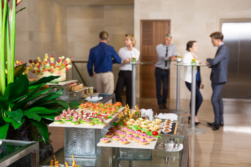 Professional corporate catering setup with diverse, high-quality dishes at an Abu Dhabi business event